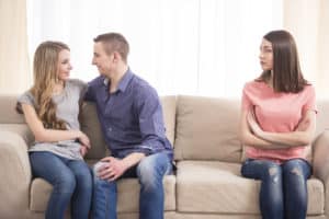 he puts his arm around other girls